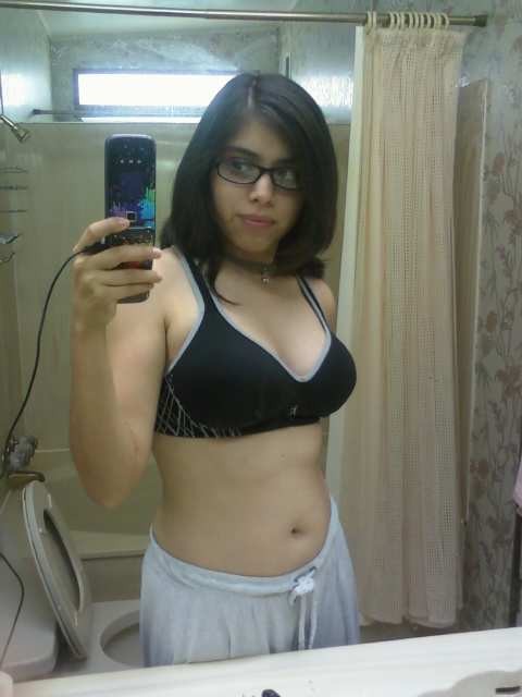 Here is a really sexy and busty indian nerdy babe She's taking self pics of